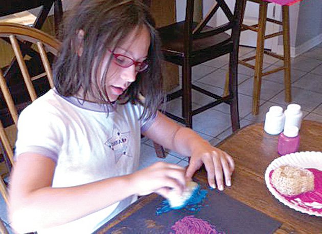 victoria-staton-daughter-of-lufa-life-founder-cathy-staton-creates-a-painting-with-slices-of-loofah-sponge-cathy-sells-pre-made-sponge-painting-kits-to-raise-money-for-the-organization