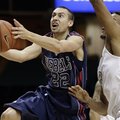 Mississippi guard Marshall Henderson (22) drives past Vanderbilt guard Kevin Bright, right, in the f...