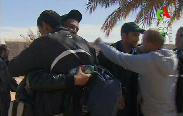 rescued-hostages-hug-each-other-in-ain-amenas-algeria-in-this-image-taken-from-television-friday-jan-18-2013
