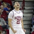Arkansas' Kikko Haydar (20) celebrates after an Arkansas basket during the second half an NCAA colle...