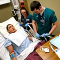 Natasha Marlow, left, of Huntsville and Nathan Snarr of Fayetteville administer a nasogastric intuba...