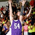 Alex Scharlau, a Springdale senior, tries to get a layup around the defense of Fayetteville senior T...
