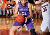 Vanessa Matlock, a Fayetteville senior, backs her way to the basket against Springdale defenders during Friday’s game at Springdale High.