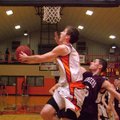 Gravette junior forward Terence Pierce attempts two under the basket, guarded by Gentry senior Robbi...
