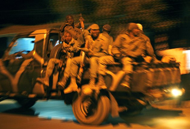 malian-soldiers-jubilate-as-they-return-to-niono-from-diabaly-some-400-kms-300-miles-north-of-the-capital-bamako-saturday-jan-19-2013-french-troops-encircled-a-key-malian-town-on-friday-trying-to-stop-radical-islamists-from-striking-against-communities-closer-to-the-capital-and-cutting-off-their-supply-line-a-french-official-said-the-move-around-diabaly-came-as-french-and-malian-authorities-said-that-the-city-whose-capture-prompted-the-french-military-intervention-in-the-first-place-was-no-longer-in-the-hands-of-the-extremists