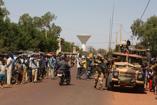 residents-of-san-in-central-mali-gather-to-look-on-as-french-troops-pass-through-en-route-to-sevare-mali-friday-jan-18-2013-french-forces-encircled-a-key-malian-town-on-friday-to-stop-radical-islamists-from-striking-closer-to-the-capital-a-french-official-said-the-move-to-surround-diabaly-came-as-french-and-malian-authorities-said-they-had-retaken-konna-the-central-city-whose-capture-prompted-the-french-military-intervention-last-week