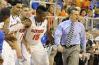 Florida coach Billy Donovan, right, shouts to his team as the clock runs down during the second half against Missouri, as his bench celebrates during an NCAA college basketball game in Gainesville, Fla., Saturday, Jan. 19, 2013. Florida won 83-52. It was Donovan's 400th career coaching win at Florida. (AP Photo/Phil Sandlin)