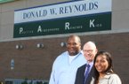 P.A.R.K. president Keith Jackson (left) is pictured with his wife Melanie (right) and Arkansas Democrat-Gazette publisher Walter E. Hussman, Jr., center, outside the Little Rock facility.