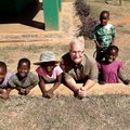 Doug Sarver, minister of global missions at Cross Church, poses with children at Esther’s House orph...