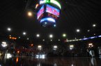 The overhead scoreboard and emergency lights illuminate the court after the main lights went out at the main lights at the C.M. "Tad" Smith Coliseum during the first half of an NCAA college basketball game between Arkansas and Mississippi in Oxford, Miss., on Saturday, Jan. 19, 2013. (AP Photo/Oxford Eagle, Bruce Newman)