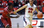 Mississippi's Marshall Henderson (22) drives against Arkansas' Fred Gulley (12) during an NCAA college basketball game in Oxford, Miss. on Saturday, Jan. 19, 2013. (AP Photo/Oxford Eagle, Bruce Newman)