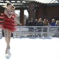 Lauren Lumpkin, 12, of Springdale performs a “scratch spin” as part of her routine Saturday during a...