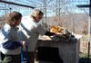 Scott Smith, vice president of Turpentine Creek Wildlife Refuge, checks the eyes of a tranquilized Siberian tiger named Tennille at Riverglen Tiger Shelter. 