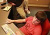 Joe Dull (top), associate professor of digital ÿlmmaking at the University of Central Arkansas in Conway, and senior Brandon Bogard work on a problem while editing Bogard’s ÿ lm Sympathy Pains. 