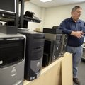 Schumacher stands next to a row of computers Friday that will be used by the Benton County Sheriff’s...