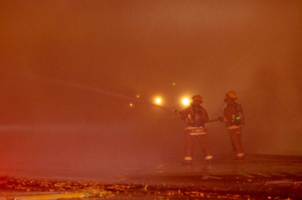 
                               
                                  Photo by Anthony Reyes&mdash;
                               
                           
                           A pair of Springdale firefighters pour water onto hot spots Sunday, Jan. 20, 2013 at a fire at an abandoned church on the north east corner of Grove Avenue and Thompson Street in Springdale.
