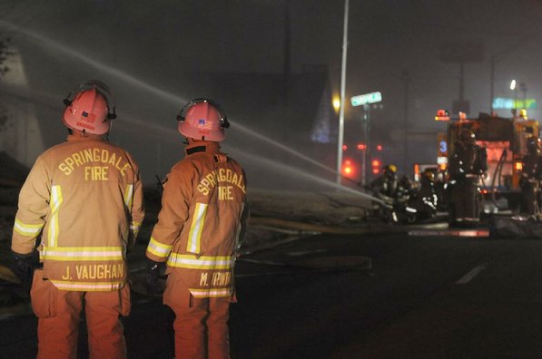 
                               
                                  Photo by Anthony Reyes&mdash;
                               
                           
                           Springdale fire chief Mike Irwin, right, and Division Chief Jim Vaughan watch as firefighters respond to a fire at an abandoned church Sunday, Jan. 20, 2013 on the north east corner of Grove Avenue and Thompson Street in Springdale.