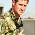 Britain's Prince Harry gives a thumbs up Friday Sept. 7, 2012 after he walked past the Apache flight...