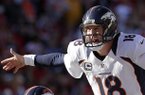 Denver Broncos quarterback Peyton Manning calls a play during the first half of an NFL football game Sunday, Nov. 25, 2012, in Kansas City, Mo. (AP Photo/Charlie Riedel)