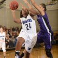 Rogers’ Taylor Strickland, left, takes the ball to the basket under pressure from Fayetteville’s Van...