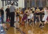 MARK HUMPHREY STAFF PHOTO -- Lincoln's Bailey Heffley is pressured in the corner by Prairie Grove's Abby Smith. Prairie Grove defeated Lincoln, 56-42, Tuesday night as the U.S. 62 rivals met.