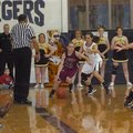 MARK HUMPHREY STAFF PHOTO -- Lincoln's Bailey Heffley is pressured in the corner by Prairie Grove's ...