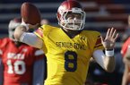 Senior Bowl South Squad quarterback Tyler Wilson of Arkansas (8) throws a pass during Senior Bowl football practice at Ladd-Peebles Stadium in Mobile, Ala., Tuesday, Jan. 22, 2013. (AP Photo/Dave Martin)