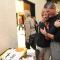 David Ferrell, right, West Fork boys coach, hugs his wife, Kelly Ferrell, while celebrating his 500t...