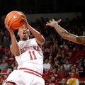 Arkansas sophomore BJ Young attempts a shot around Mississippi State freshman Fred Thomas on Wednesd...