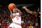 Arkansas sophomore BJ Young attempts a shot around Mississippi State freshman Fred Thomas on Wednesday, Jan. 23, 2013, at Bud Walton Arena in Fayetteville.