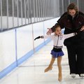 Robin Aprea, right, coach and Ozark Figure Skating Club vice president, reminds Dominika Vargas, 4, ...
