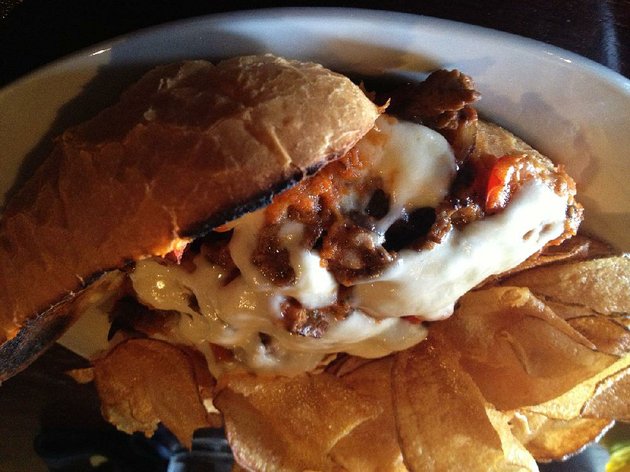 pizzeria-cheese-steak-on-the-lunch-menu-at-rj-tao-features-a-spicy-red-sauce-with-sauteed-onions-and-green-and-red-bell-peppers