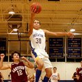 Photo by Randy Moll -- Decatur senior forward Andrew Harris breaks away from Hartford's Brody Funk a...