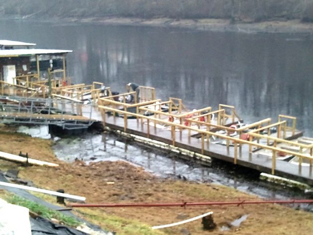 crews-are-working-to-repair-the-dock-at-lindseys-resort-on-the-little-red-river-near-heber-springs-and-other-damages-resulting-from-the-winter-storm-that-hit-the-area-christmas-day