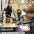 Vick Kelley, right, with The Goddess Festival, talks with Carlous Guthrie during the opening of the ...