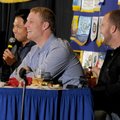 Bruce Chen, Will Smith and Danny Duffy, from left, Kansas City Royals players, laugh along with a st...