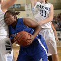 Taylor Strickland, center, of Rogers High pushes into Springdale Har-Ber’s Tayleah Neal while drivin...