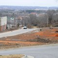 Several residential lots sit vacant on land east of the Evelyn Hills Shopping Center. A Springdale-b...
