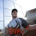 Brandon Allen of Fredonia, Kan., stretches Saturday before taking his first at bat during the first ...