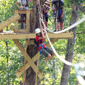 Amber Simmons, of Orange Grove, Texas, takes off from a platform on one of nearly a dozen zip lines ...