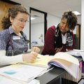 Marr-Lynn Flory, left, and LaTure Hicks, both advanced practical nurses, discuss the care of a patie...