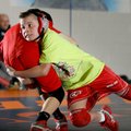 Brendan Davis, left, 12, and Gavin Goddard, 10, wrestle during practice Jan. 21 inside The Annex in ...