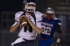 Greenwood quarterback Jabe Burgess looks for a receiver during a 2012 game at Little Rock Parkview. 