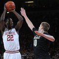 NWA MEDIA/SAMANTHA BAKER -- Arkansas' Jacorey Williams, left, shoots over Josh Henderson of Vanderbi...