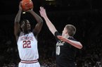 NWA MEDIA/SAMANTHA BAKER -- Arkansas' Jacorey Williams, left, shoots over Josh Henderson of Vanderbilt Saturday, Jan. 12, 2013, at Bud Walton Arena.