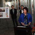 Karen Parker, from right, senior manager with the Walmart Foundation, gives a few remarks Monday as ...