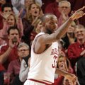 Arkansas junior forward Marshawn Powell (33) motions to his teammates against Oklahoma in the second...