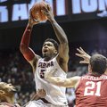 Alabama guard Trevor Lacey (5) takes a leaping shot during an NCAA college basketball game against A...