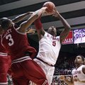Alabama guard Trevor Lacey (5) takes a shot while Arkansas guard Rickey Scott (3) blocks during an N...