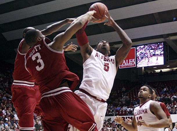 alabama-guard-trevor-lacey-5-takes-a-shot-while-arkansas-guard-rickey-scott-3-blocks-during-an-ncaa-college-basketball-game-in-tuscaloosa-ala-thursday-jan-31-2013-ap-phototuscaloosa-news-michelle-lepianka-carter